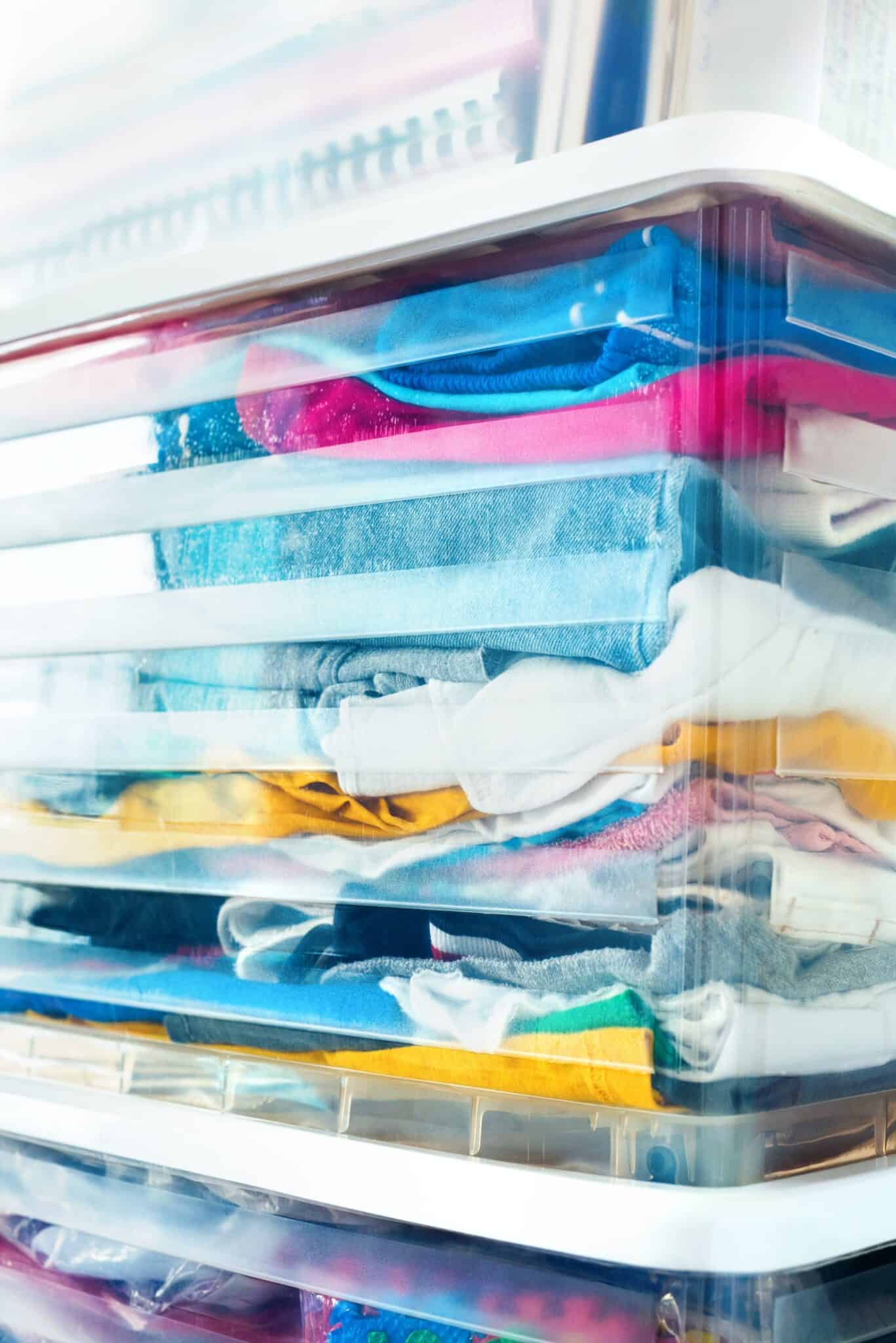 clothes stored in airtight plastic bins with lids